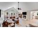 Open living room with vaulted ceilings, a fireplace, and modern decor leading to a dining area at 812 Timber Creek Dr, York, SC 29745