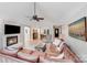 Spacious living room features a fireplace, leather couch, adjacent to dining area and kitchen at 812 Timber Creek Dr, York, SC 29745