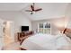 Bright main bedroom with white bedding, tv, and a large window allowing ample natural light at 812 Timber Creek Dr, York, SC 29745