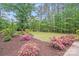 Expansive yard with flowering bushes and mature trees providing a private, peaceful setting at 812 Timber Creek Dr, York, SC 29745