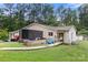 Exterior view of the backyard with a wooden ramp, grassy area and trailer at 814 Columbia Dr, Chester, SC 29706