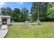 Large, fenced backyard with mature trees provides privacy and ample space at 814 Columbia Dr, Chester, SC 29706