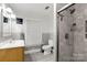 Well-lit bathroom with white vanity, tile shower and modern fixtures at 814 Columbia Dr, Chester, SC 29706