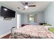 Comfortable bedroom with blue walls, wood floors and ceiling fan at 814 Columbia Dr, Chester, SC 29706