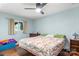 This bright bedroom features hardwood floors and a ceiling fan at 814 Columbia Dr, Chester, SC 29706