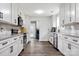 Spacious kitchen with white cabinets, stainless steel appliances, and wood floors at 814 Columbia Dr, Chester, SC 29706