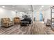Bright, open-plan living room with hardwood floors and ceiling fan at 814 Columbia Dr, Chester, SC 29706