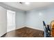 Room with hardwood flooring, light blue painted walls, and a view to the exterior at 814 Columbia Dr, Chester, SC 29706