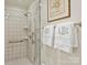 White tiled shower with glass door in a bright bathroom at 916 Cherokee Rd, Charlotte, NC 28207