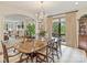 Formal dining room with a chandelier, large window, and view to the living room at 916 Cherokee Rd, Charlotte, NC 28207