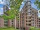 Elegant brick condo building features curved windows and underground parking at 916 Cherokee Rd, Charlotte, NC 28207