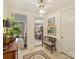 Welcoming foyer with tile flooring, vintage bench, and views to living areas at 916 Cherokee Rd, Charlotte, NC 28207