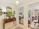 Traditional foyer with a wood console table, mirror, and views to other rooms at 916 Cherokee Rd, Charlotte, NC 28207