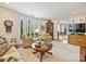 Comfortable living area with built in shelving, neutral colors, and hardwood floors at 916 Cherokee Rd, Charlotte, NC 28207