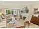 Bright living room featuring neutral décor, large windows, and a cozy fireplace at 916 Cherokee Rd, Charlotte, NC 28207