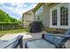 Enjoy this backyard with a patio, grill, and lush green trees offering a great space for outdoor relaxation at 9713 Autumn Applause Dr, Charlotte, NC 28277