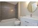 Bathroom featuring new vanity with white marble top, dark subway tile shower, and updated lighting at 9713 Autumn Applause Dr, Charlotte, NC 28277