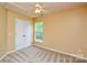 Bedroom with neutral paint, standard closet, window, and ceiling fan at 9713 Autumn Applause Dr, Charlotte, NC 28277
