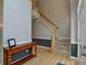 View of a two-story foyer, featuring hardwood floors, a staircase, and gray and white walls at 9713 Autumn Applause Dr, Charlotte, NC 28277