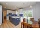 Spacious kitchen with a center island, stainless steel appliances, and a dining area at 9713 Autumn Applause Dr, Charlotte, NC 28277