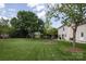 Expansive backyard showcasing a well-maintained lawn and a fenced perimeter at 1002 Banaba Dr, Indian Trail, NC 28079