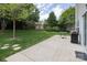 Lush backyard offers a beautiful green lawn, a well-kept patio, and ample space for outdoor activities at 1002 Banaba Dr, Indian Trail, NC 28079