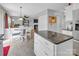 Open floor plan showcasing dining area with kitchen island and connection to the living room at 1002 Banaba Dr, Indian Trail, NC 28079
