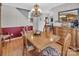 Well-lit dining room featuring wood floors, a large table, and classic furniture details throughout at 1002 Banaba Dr, Indian Trail, NC 28079