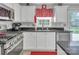 Modern kitchen featuring stainless steel appliances, granite countertops, and ample lighting at 1002 Banaba Dr, Indian Trail, NC 28079