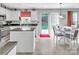 Bright kitchen with a view of the backyard from the window above the sink and adjacent dining area at 1002 Banaba Dr, Indian Trail, NC 28079