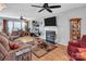 Comfortable living room with hardwood floors, a fireplace, and natural light streaming in from multiple windows at 1002 Banaba Dr, Indian Trail, NC 28079