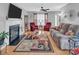 Spacious living room with hardwood floors, a cozy fireplace, and ample seating for Gathering and guests at 1002 Banaba Dr, Indian Trail, NC 28079