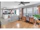 Bright office area with large windows, hardwood flooring, and adjacent to the kitchen at 1002 Banaba Dr, Indian Trail, NC 28079