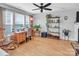 Comfortable home office with wooden desk, rolling chair, shelving, and natural light at 1002 Banaba Dr, Indian Trail, NC 28079