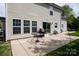 Outdoor patio featuring a grill, table, and sliding doors leading into the home's interior at 1002 Banaba Dr, Indian Trail, NC 28079