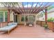 The back deck offers an appealing swing and comfortable seating, enhanced by a stylish pergola at 1009 Anduin Falls Dr, Charlotte, NC 28269