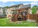A well-maintained backyard features a spacious deck, and lush green lawn perfect for outdoor activities at 1009 Anduin Falls Dr, Charlotte, NC 28269