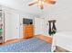 Bedroom featuring a bed, TV on a dresser, and wood floors, perfect for resting or watching movies at 1009 Anduin Falls Dr, Charlotte, NC 28269