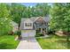 The charming two-story home has a well-maintained front yard, a two-car garage, and inviting curb appeal at 1009 Anduin Falls Dr, Charlotte, NC 28269