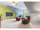 Spacious living room with a ceiling fan, a chalkboard and fun paint scheme, perfect for relaxing or exercising at 1009 Anduin Falls Dr, Charlotte, NC 28269