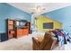 Spacious living room with a ceiling fan, large TV, and fun paint scheme, perfect for relaxing or entertaining at 1009 Anduin Falls Dr, Charlotte, NC 28269