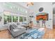 Bright living room with bar seating, hardwood floors, and large windows at 1009 Anduin Falls Dr, Charlotte, NC 28269