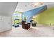 Spacious living room with a ceiling fan, a chalkboard and fun paint scheme, perfect for relaxing or exercising at 1009 Anduin Falls Dr, Charlotte, NC 28269