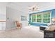 Comfortable loft area with large windows, cozy seating, and ample natural light at 1009 Anduin Falls Dr, Charlotte, NC 28269