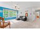 Open loft area with natural light, comfortable seating, and neutral carpeting at 1009 Anduin Falls Dr, Charlotte, NC 28269