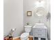 Well-lit powder room features modern sink, vanity, and neutral decor at 1009 Anduin Falls Dr, Charlotte, NC 28269