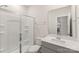 Bright bathroom with a walk-in shower and modern vanity at 1020 Clementine Rd, Monroe, NC 28110