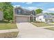 Attractive two-story brick home featuring an attached two-car garage and a neatly paved driveway at 1020 Clementine Rd, Monroe, NC 28110