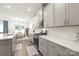 Sleek kitchen featuring gray cabinets, white countertops, and stainless steel appliances, creating an inviting atmosphere at 1020 Clementine Rd, Monroe, NC 28110