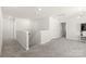 Open concept living room leading to a stairway and featuring neutral walls and plush carpeting at 1020 Clementine Rd, Monroe, NC 28110